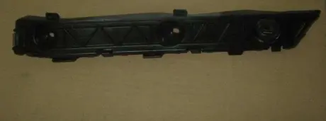 Направляющая переднего бампера, левая (пластик) Aftermarket 1018054267